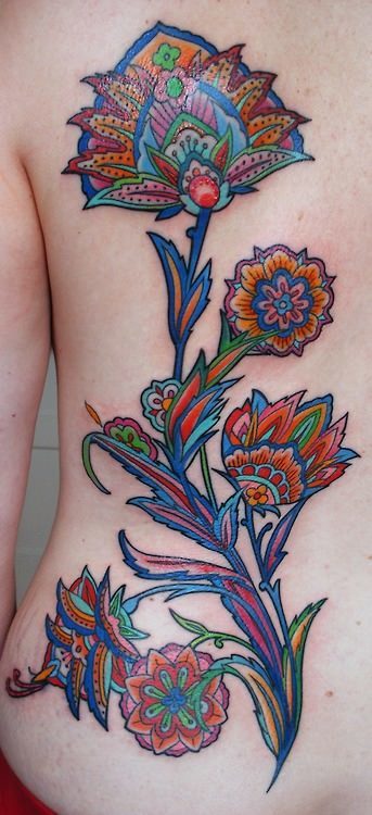Superb Paisley Pattern Flower Tattoo On Back