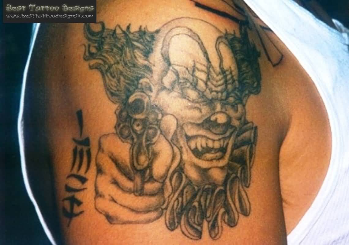 Terrific Gangsta Clown Tattoo On Right Shoulder For Men