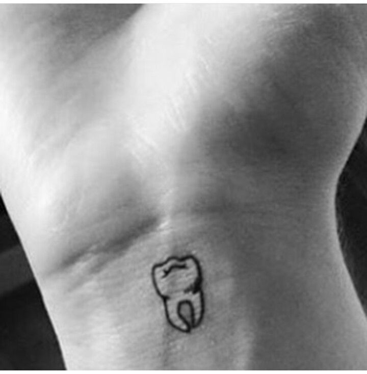 Tiny Molar Tattoo On Wrist