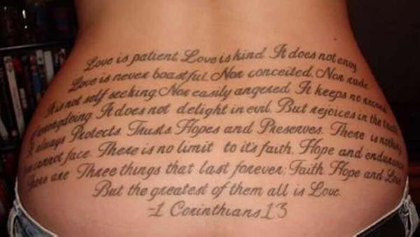 Very Long Love Quote Tattoo On Lower Back