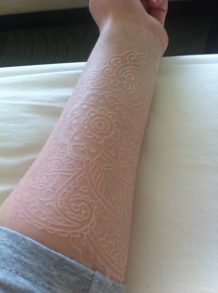 White Ink Flower Paisley Pattern Tattoo On Forearm