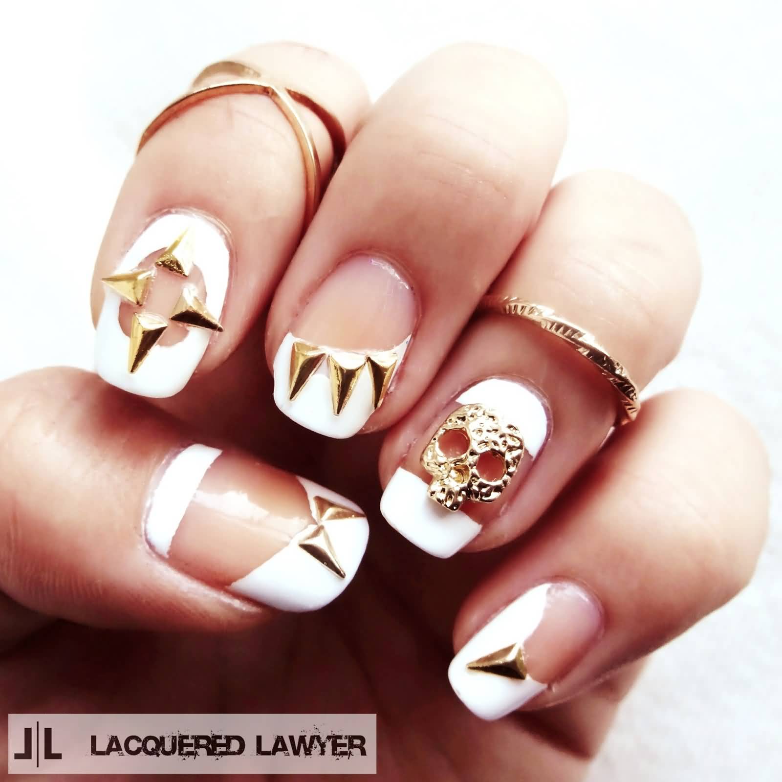 White Negative Space Nail Art With Skulls And Spikes Design Idea