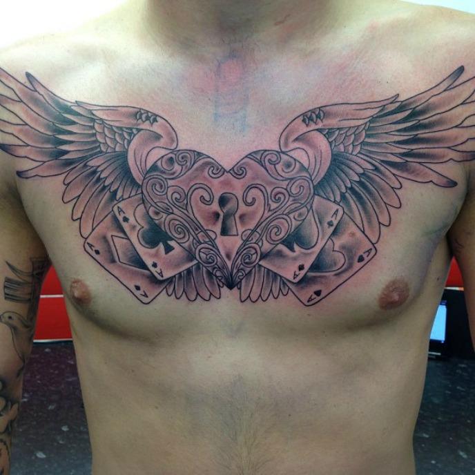 Winged Love Lock And Cards Tattoo On Chest For Men