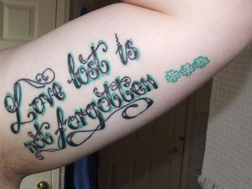 Wonderful Love Quote Tattoo On Biceps
