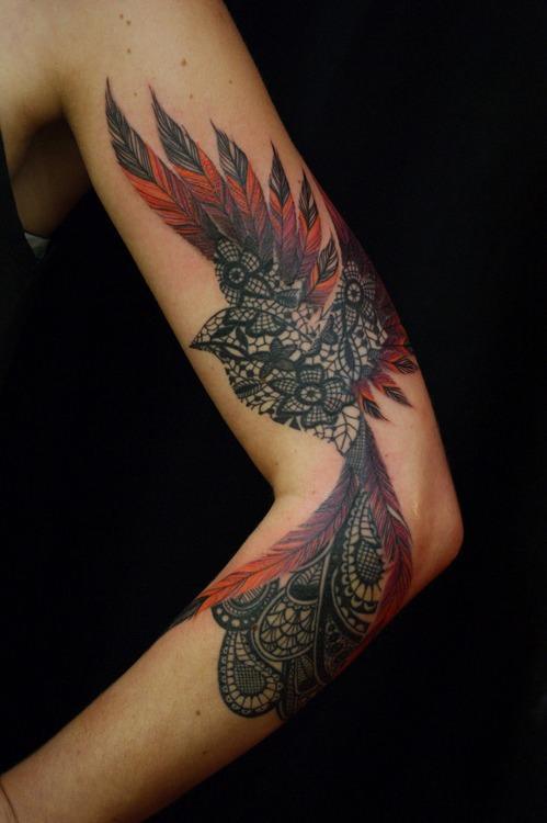 Wonderful Paisley Pattern Flying Bird Tattoo On Sleeve