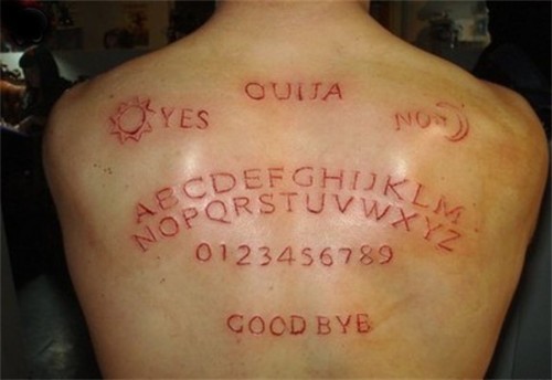 Alphabet And Words Skin Scarification Tattoo On Upper Back