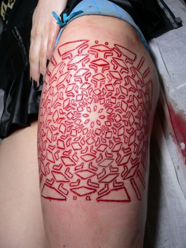 Amazing Skin Scarification Pattern Tattoo On Thigh