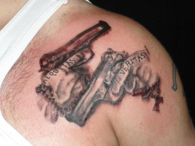 Awesome Pistols Weapons Tattoo On Left Shoulder