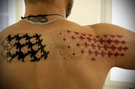 Awesome Red And Black Birds Escher Tattoo On Upper Back