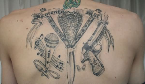 Awesome Snake With Music Notes And Pistol Weapons Tattoo On Upper Back