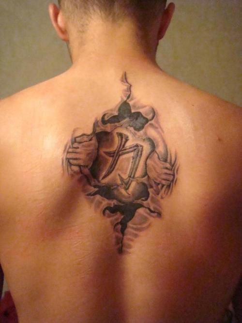 Awesome Strength Coming Outside Tattoo On Upper Back