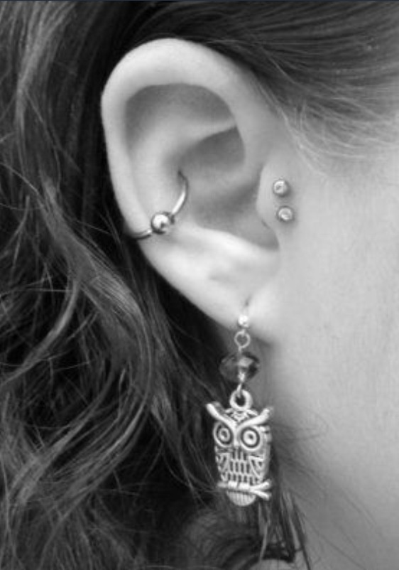 Beautiful Conch And Double Tragus Piercing On Right Ear