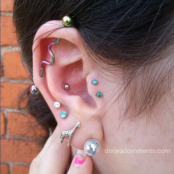 Beautiful Ear Piercing And Double Tragus Piercing With Green Anchors