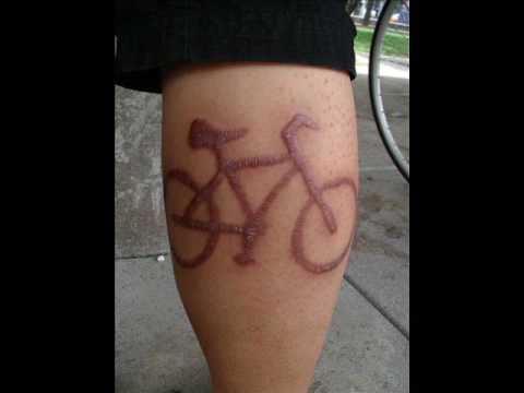 Bicycle Scarification Tattoo On Leg
