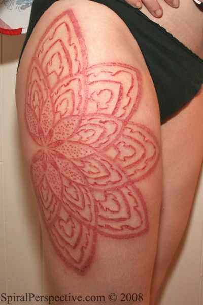Big Flower Scarification Tattoo On Right Thigh