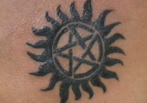 Black David Star In Sun Tattoo