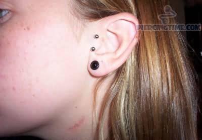 Black Gauge Lobe And Double Tragus Piercing With Barbell