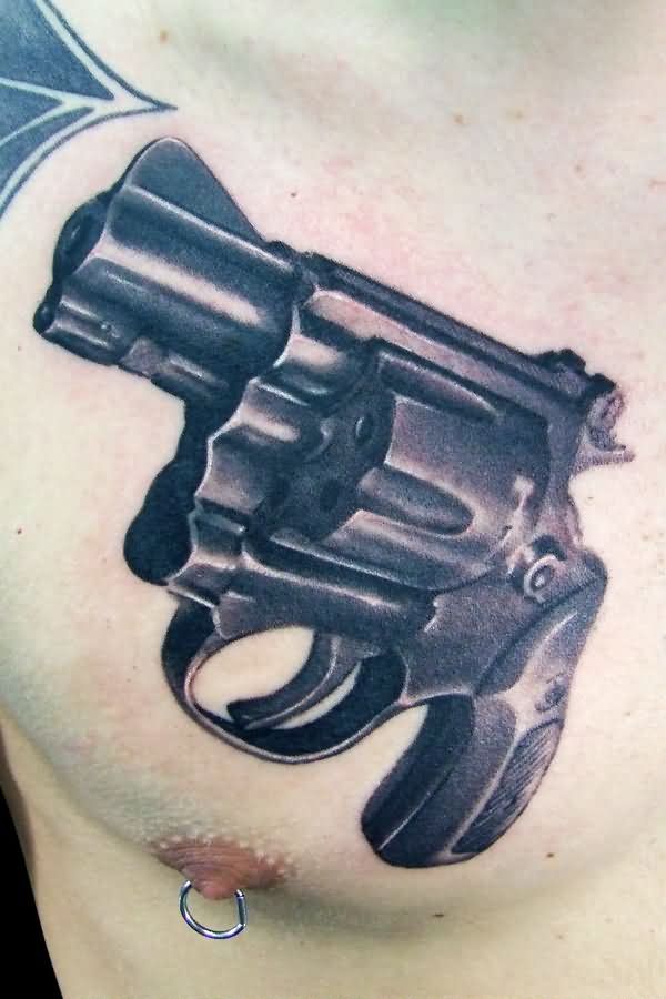 Black Ink Pistol Weapons Tattoo On Chest