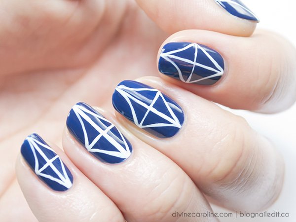Blue Nails With White Geometric Pattern Design Nail Art