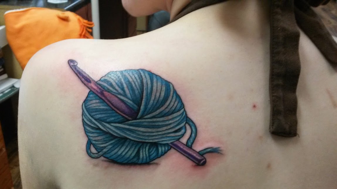 Blue Yarn With Crochet Hook Tattoo On Left Back Shoulder