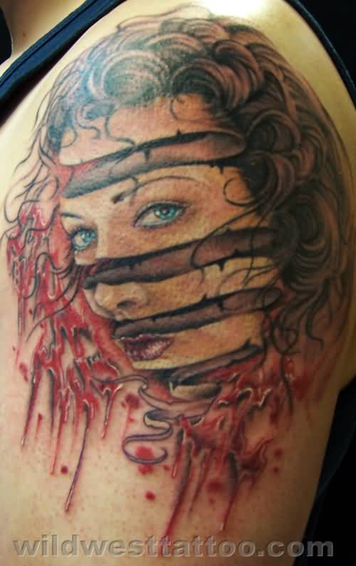 Brilliant Escher Face Portrait Rind Tattoo On Left Shoulder
