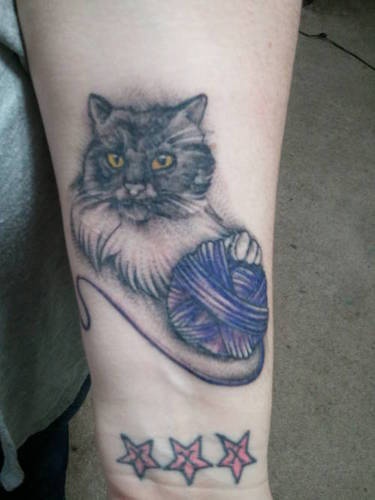 Cat With Yarn Ball Tattoo On Arm