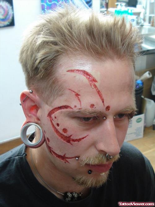 Cool Scarification Tattoo On Face For Men