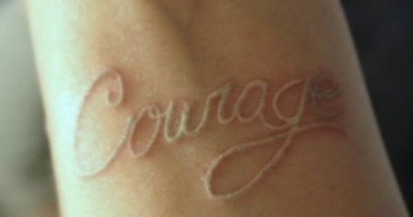 Courage Scarification Tattoo On Arm