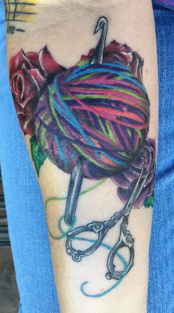 Crochet Hook With Yarn And Scissor Tattoo On Forearm