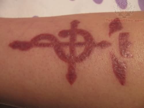 Cross Snake Scarification Tattoo On Arm