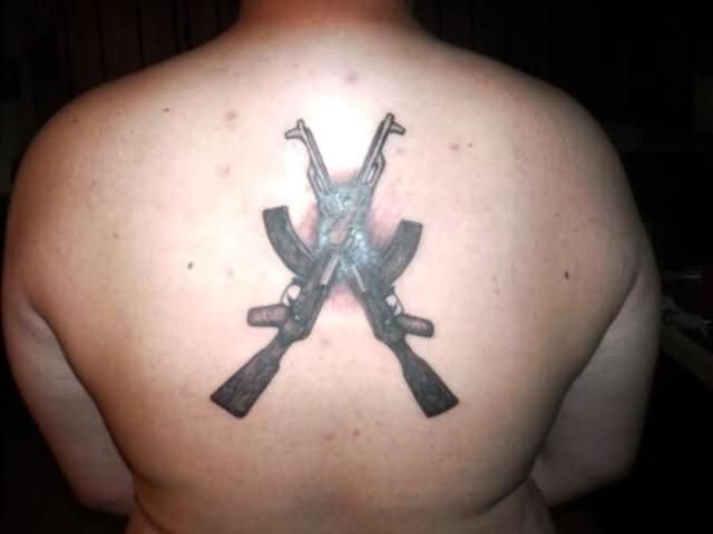 Crossed Ak47 Weapons Tattoo On Upper Back