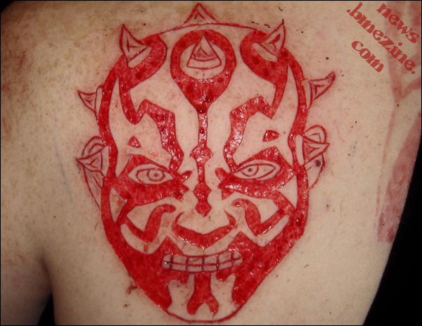 Devil Scarification Tattoo