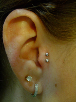 Double Lobe And Double Tragus Piercings On Right Ear