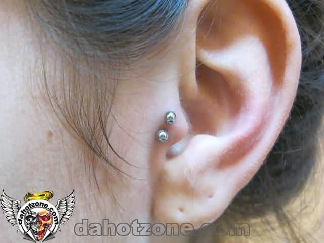 Double Tragus Piercing On Left Ear With Silver Studs