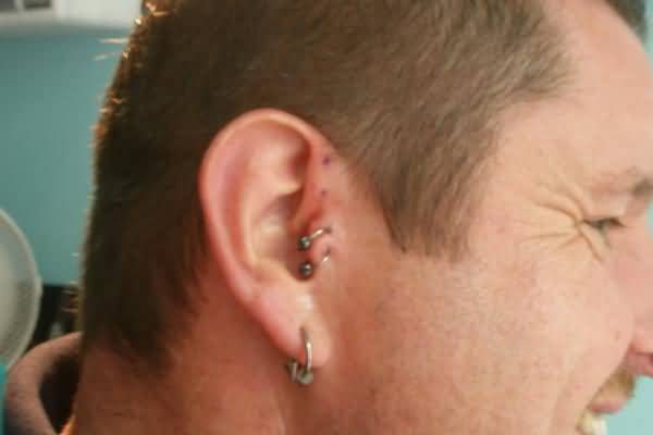 Double Tragus Piercing With Bead Rings