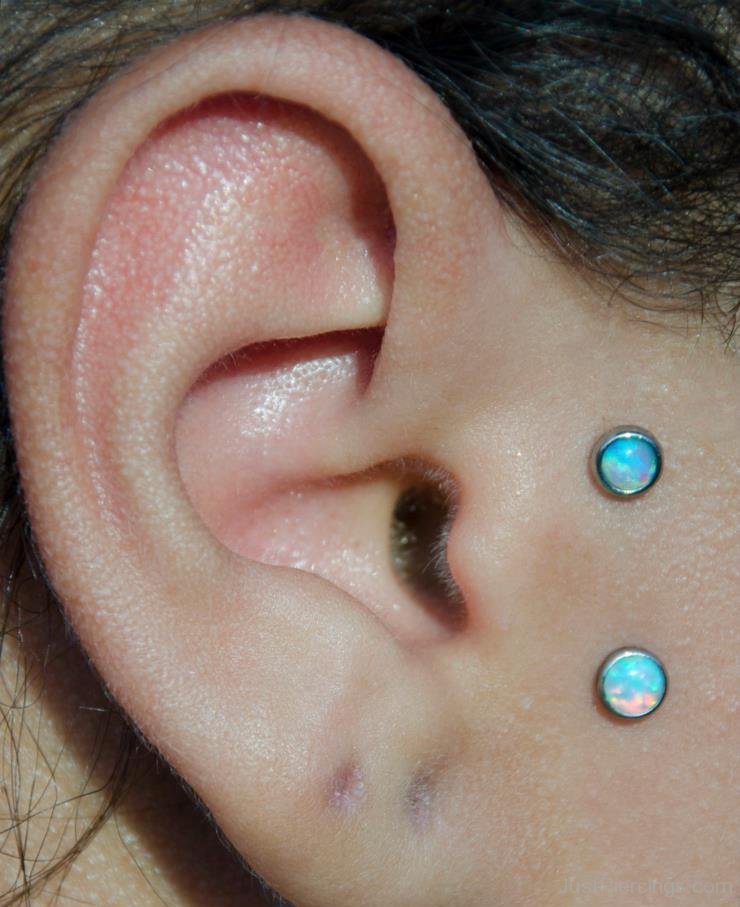 Double Tragus Piercing With Blue Opal Studs