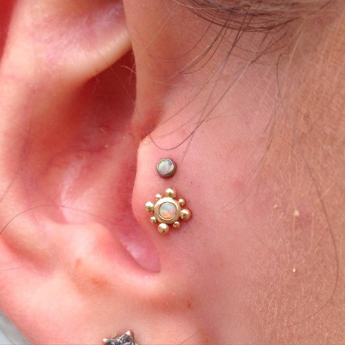 Double Tragus Piercing With Opal Studs