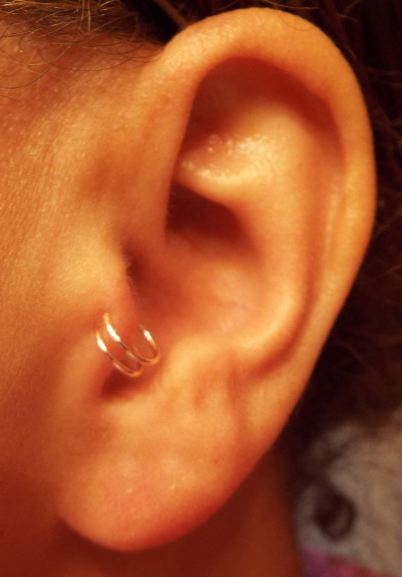 Double Tragus Piercing With Silver Round Rings