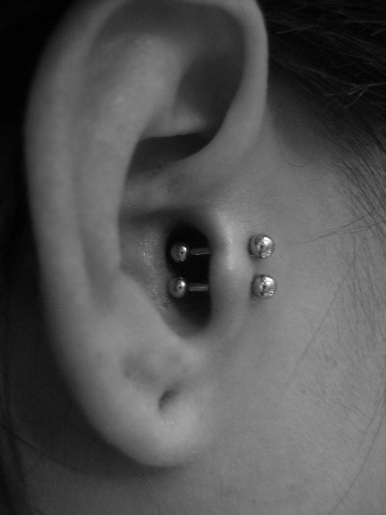 Double Tragus Piercing With Small Silver Studs