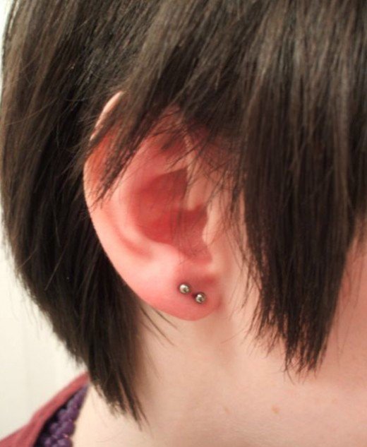 Dual Earlobe Piercing With Silver Studs On Right Ear