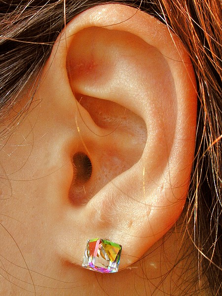 Earlobe Piercing With Colorful Cube Stud