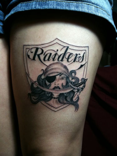 Female Oakland Raiders Logo Thigh Tattoo