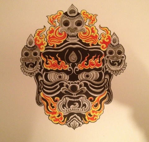Flaming Tibetan Mask Tattoo Design