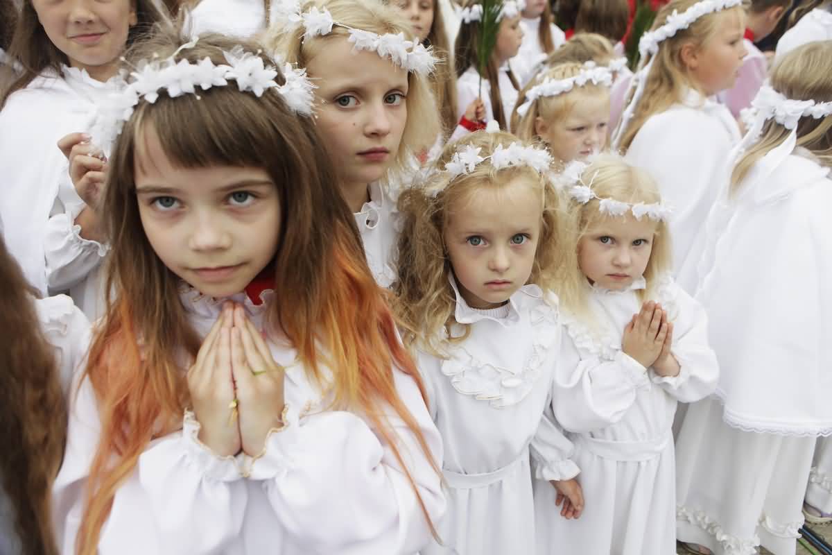Girls In White Dress During Feast Of The Assumption Of Mary Celebration