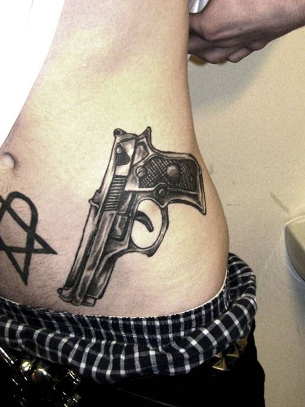 Grey Gun Weapons Tattoo On Left Hip