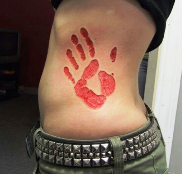 Hand Print Scarification Tattoo On Side Rib