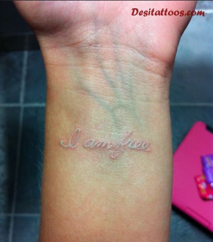 I Am Free Scarification Tattoo On Wrist