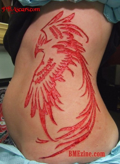 Impressive Bird Scarification Tattoo On Side Rib