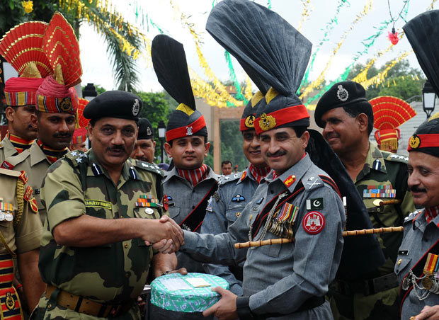 Indian And Pakistan Army Personnel Sharing Sweets On The Occasion Of Independence Day
