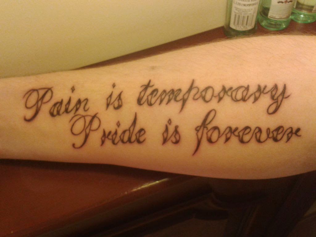 Inspiring Strength Quote Tattoo On Forearm